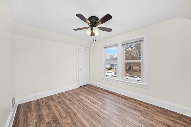 unfurnished room featuring hardwood / wood-style flooring, ceiling fan, and lofted ceiling