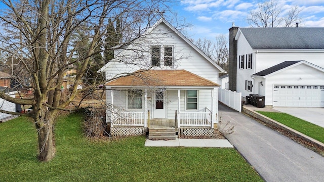 front of property featuring a front lawn and covered porch