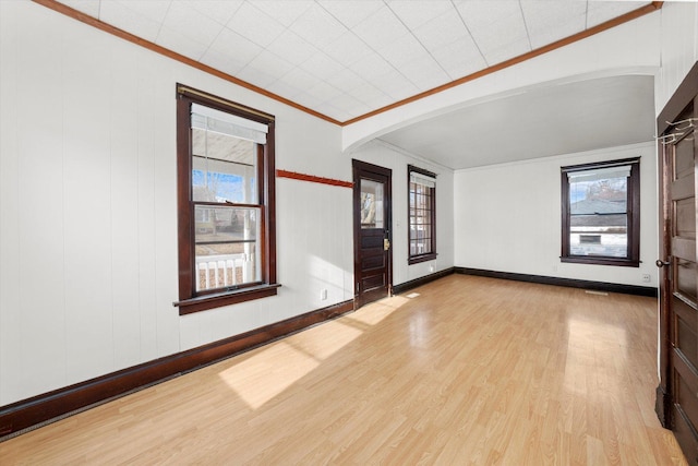 interior space featuring ornamental molding and light hardwood / wood-style flooring