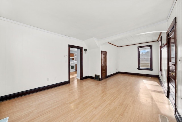 unfurnished room featuring light wood-type flooring and crown molding