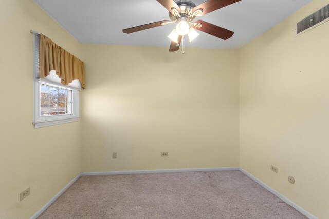 unfurnished room featuring ceiling fan and light colored carpet