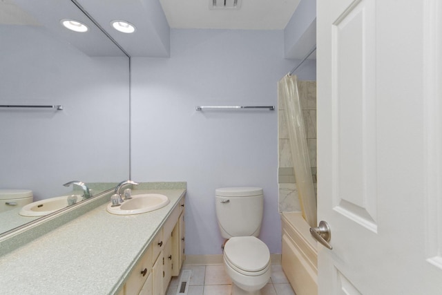 full bathroom featuring tile patterned floors, vanity, shower / bath combination with curtain, and toilet