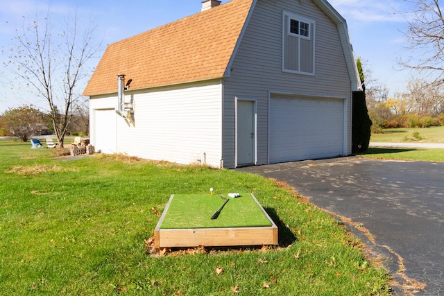 view of property exterior with a lawn