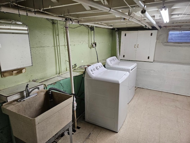 laundry area with sink and washing machine and clothes dryer