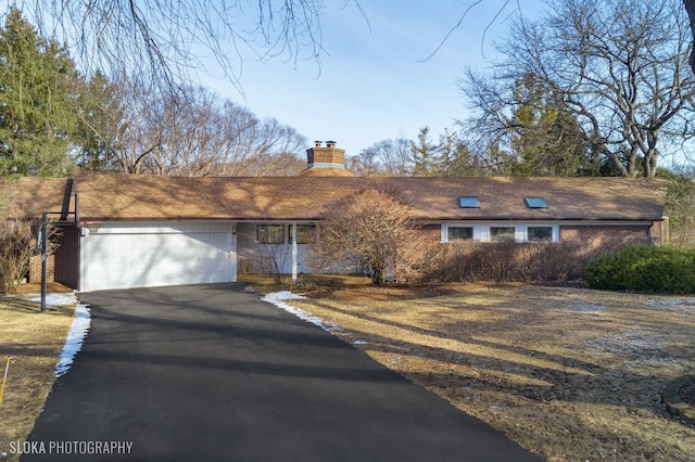 single story home with a garage