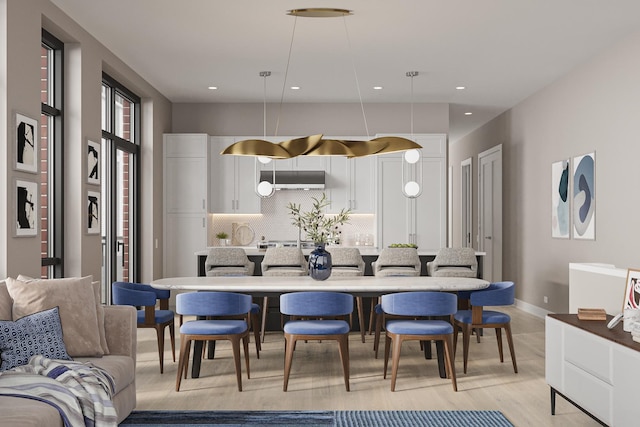 kitchen featuring pendant lighting, white cabinetry, baseboards, and decorative backsplash