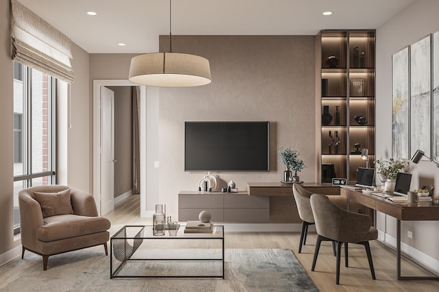 living area with light wood-type flooring, baseboards, and recessed lighting