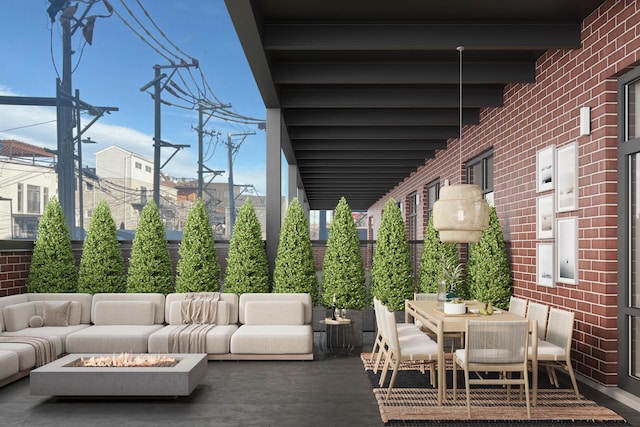 view of patio featuring outdoor dining space and an outdoor living space with a fire pit