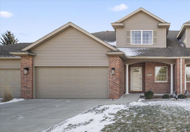 front facade with a garage