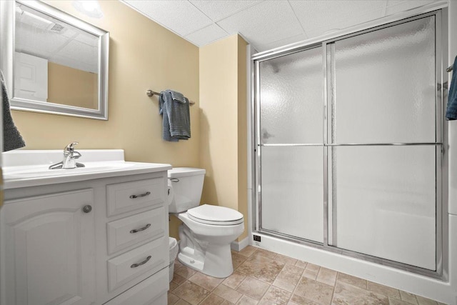 bathroom featuring walk in shower, vanity, and toilet