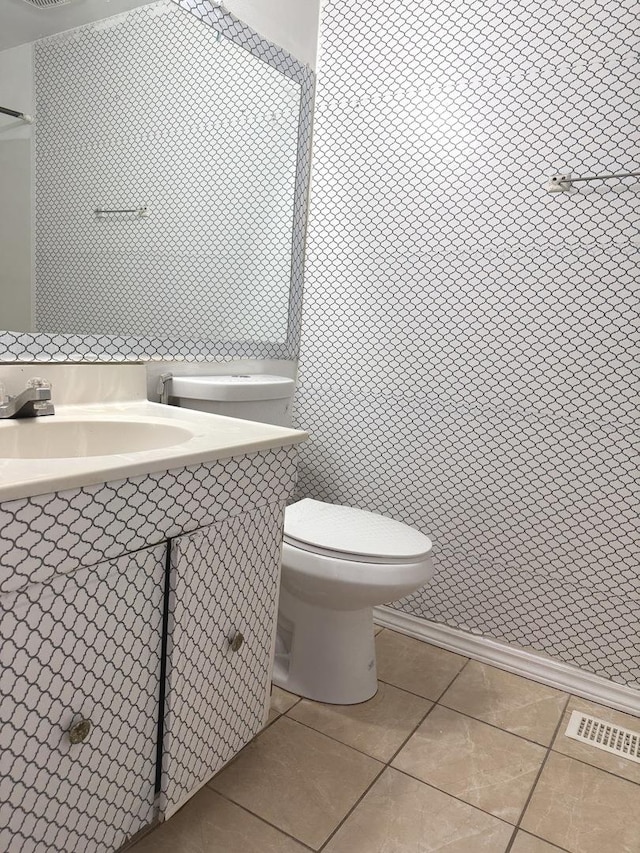 bathroom with tile patterned floors, toilet, and sink