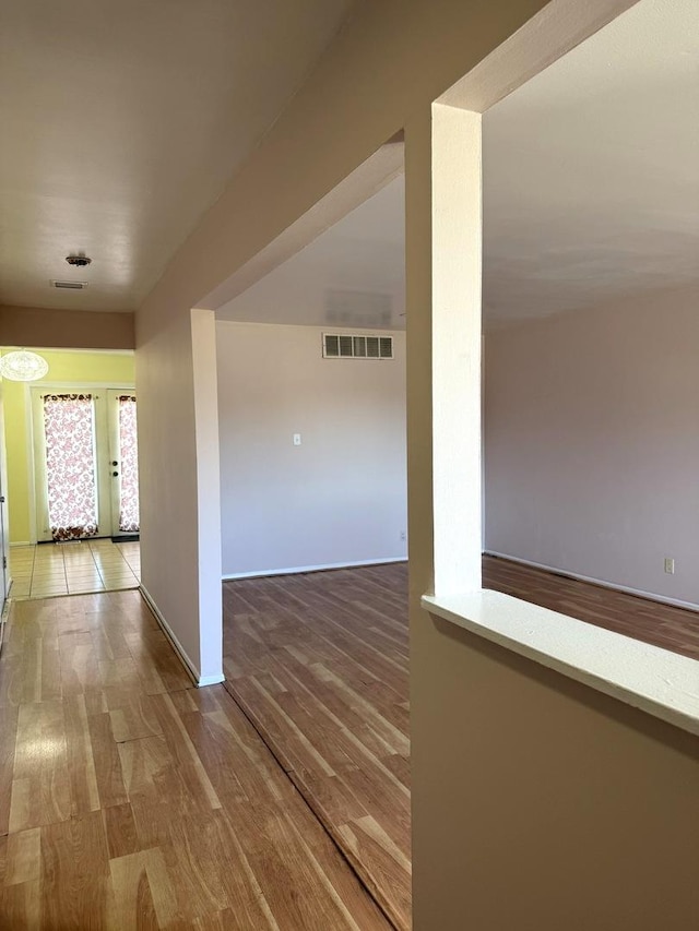 hallway with wood-type flooring