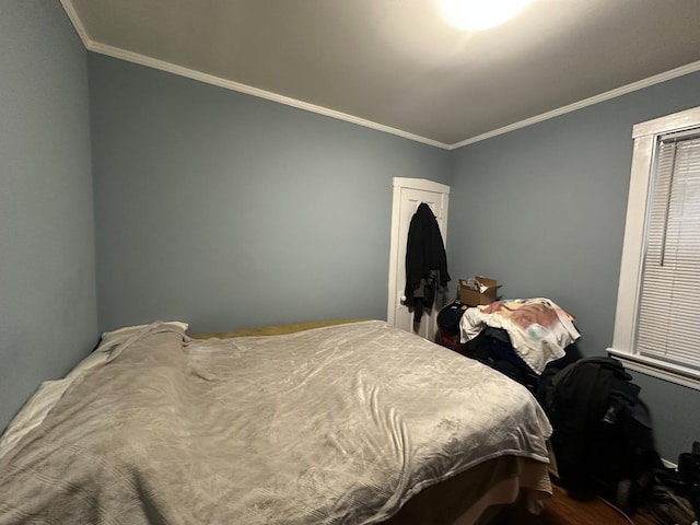 bedroom with ornamental molding