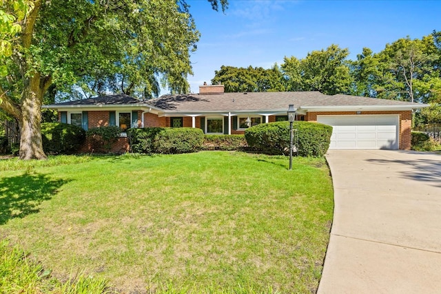 single story home featuring a front yard and a garage