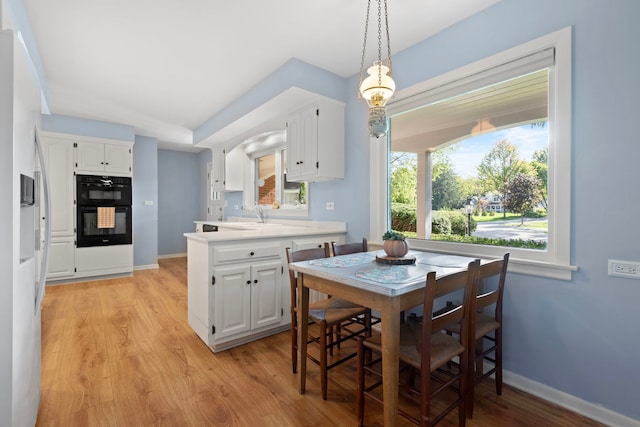 dining area featuring light hardwood / wood-style floors