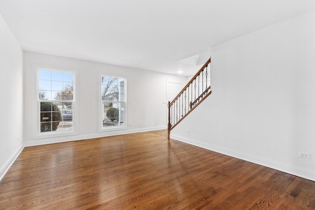 unfurnished living room with wood-type flooring