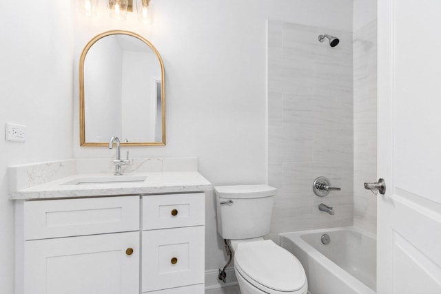 full bathroom with tiled shower / bath combo, toilet, and vanity