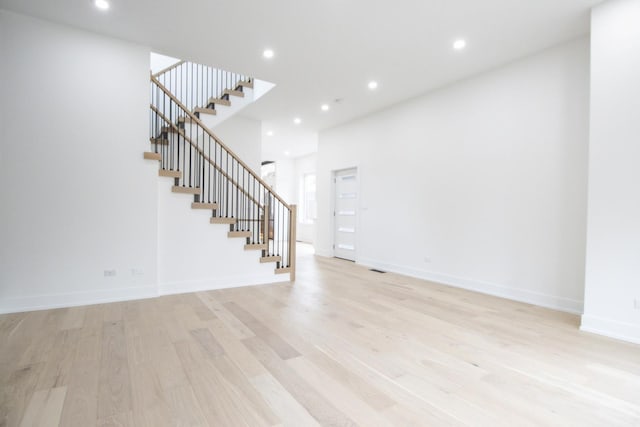 unfurnished living room featuring light wood-type flooring