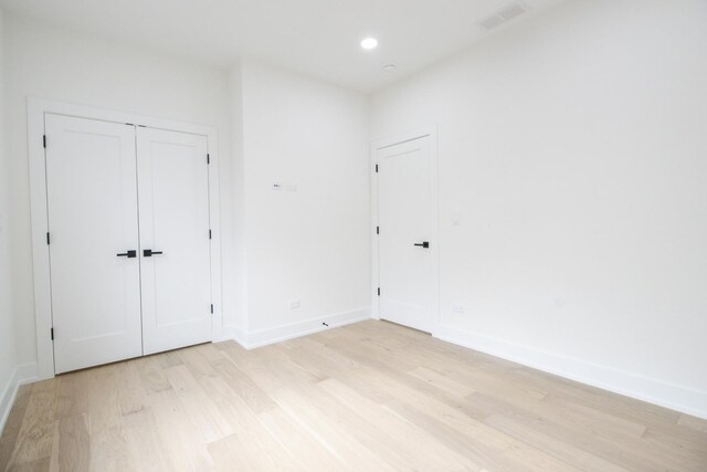 unfurnished room featuring light hardwood / wood-style floors