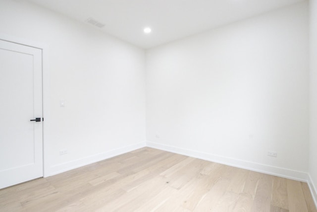 spare room with light wood-type flooring