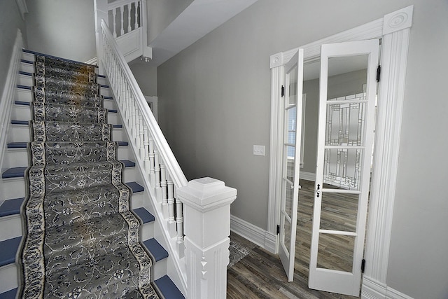 staircase featuring wood-type flooring