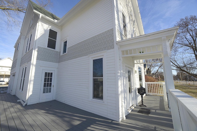 view of side of home with a deck