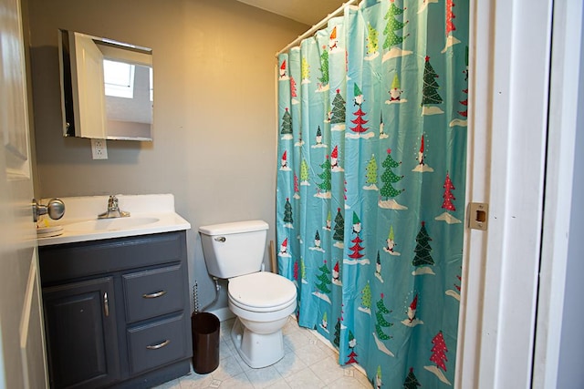 bathroom featuring vanity, toilet, and tile patterned flooring