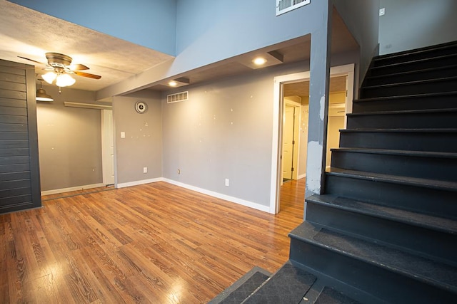 spare room with wood-type flooring and ceiling fan