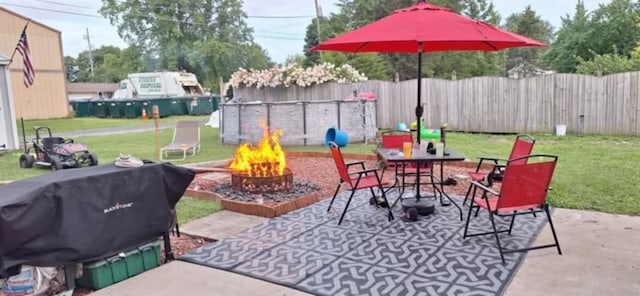 view of patio / terrace featuring grilling area and an outdoor fire pit