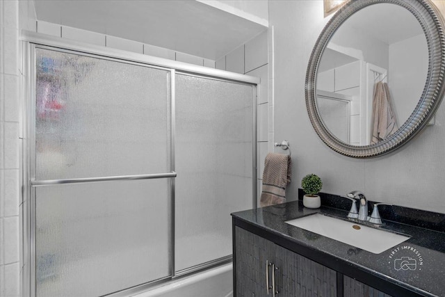 bathroom featuring vanity and enclosed tub / shower combo