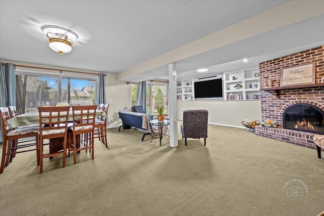 dining space with carpet flooring, a brick fireplace, and built in features