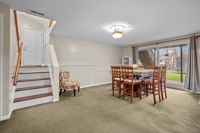 dining space featuring carpet floors