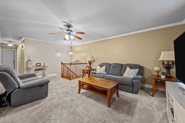 carpeted living room featuring ceiling fan and ornamental molding