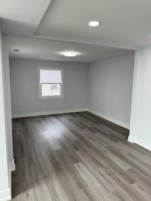 empty room featuring wood-type flooring