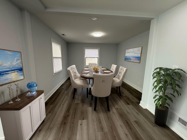 dining room featuring dark wood-type flooring