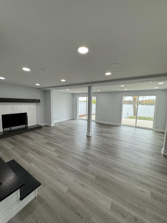 unfurnished living room featuring a fireplace