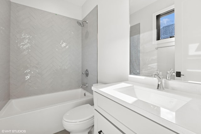 full bathroom featuring vanity, toilet, and tiled shower / bath combo