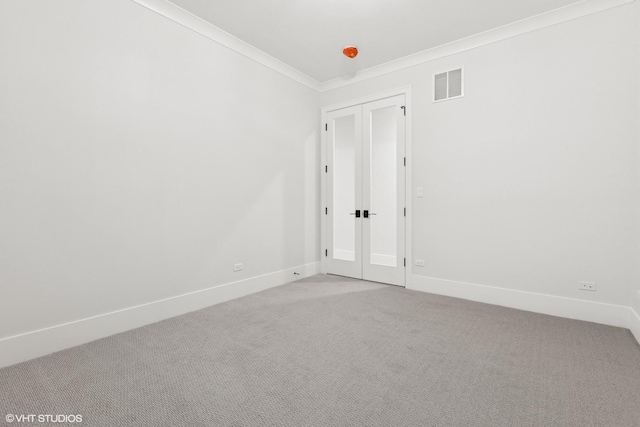 empty room with carpet floors and ornamental molding