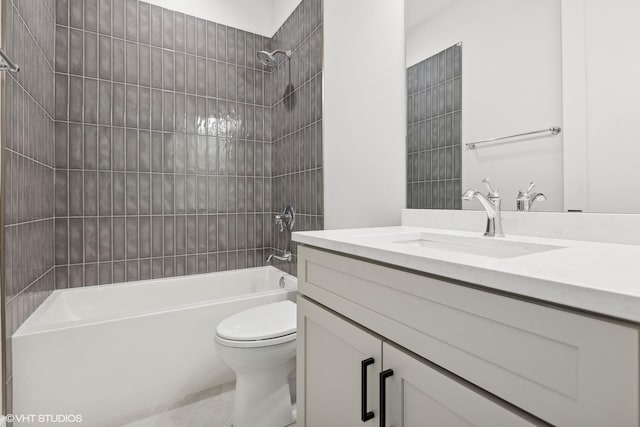 full bathroom with tiled shower / bath combo, vanity, and toilet