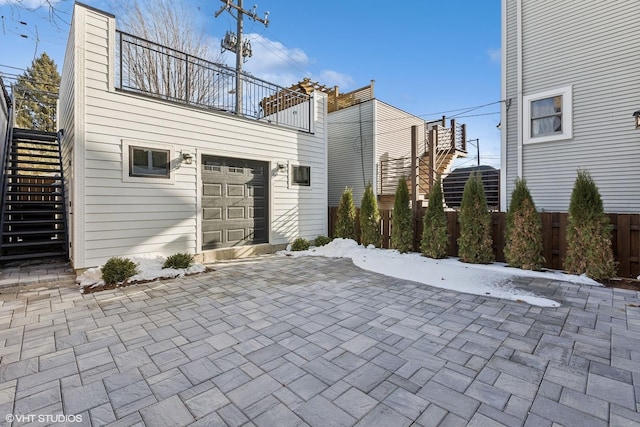 exterior space with a balcony and a garage