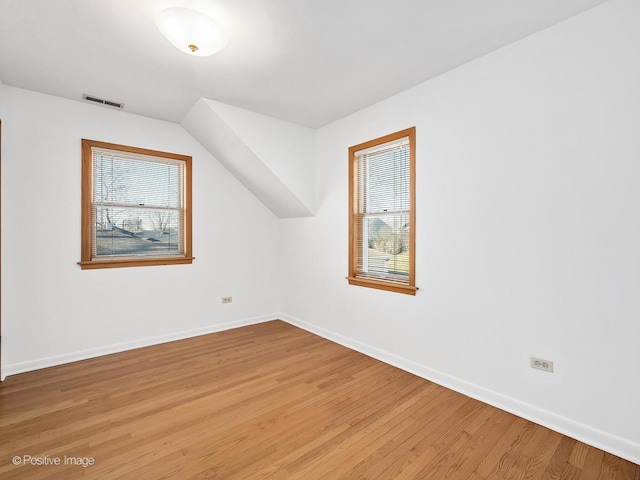 bonus room featuring hardwood / wood-style floors