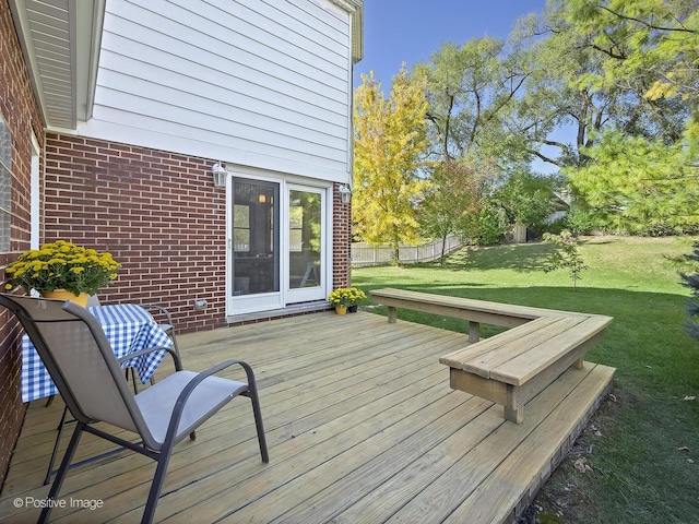 deck featuring a lawn