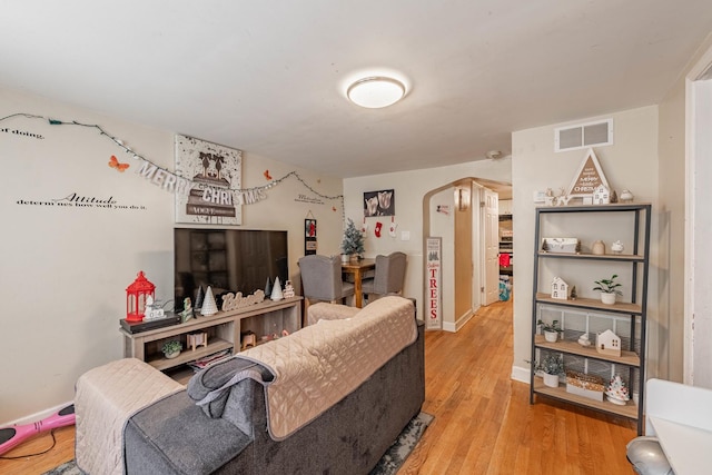 living room with light hardwood / wood-style floors