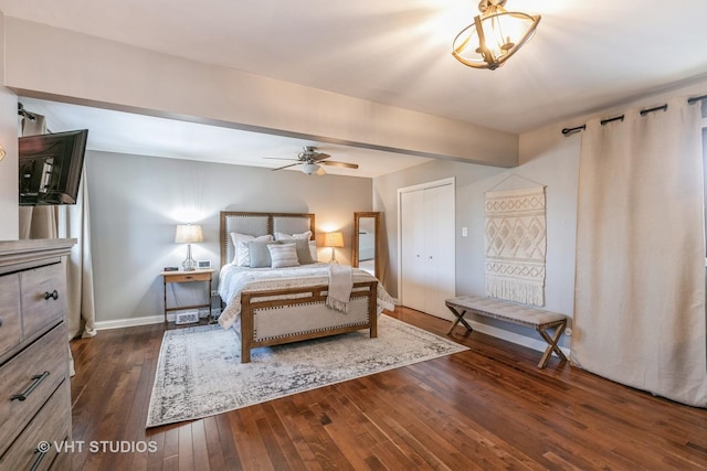 bedroom featuring ceiling fan and dark hardwood / wood-style flooring