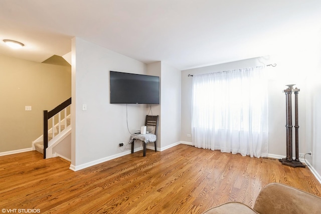 unfurnished living room with wood-type flooring