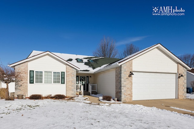 single story home featuring a garage and brick siding