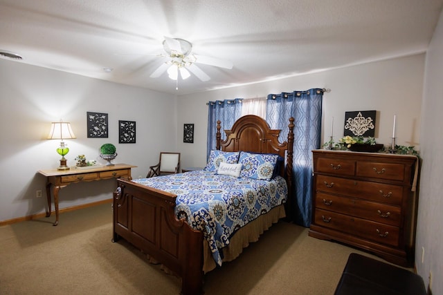 bedroom featuring light carpet, baseboards, visible vents, and a ceiling fan