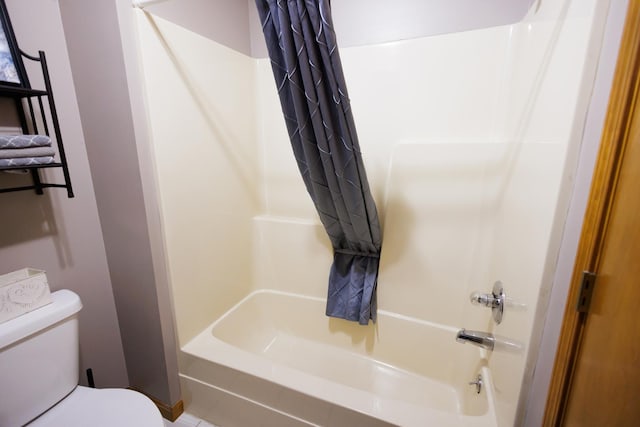 bathroom with toilet and shower / bathtub combination with curtain