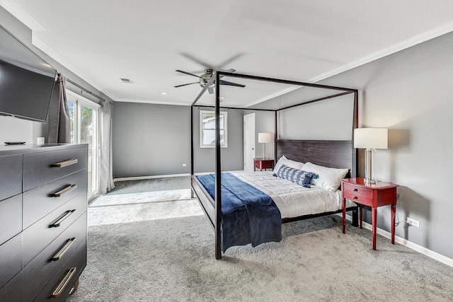 carpeted bedroom featuring ceiling fan and ornamental molding