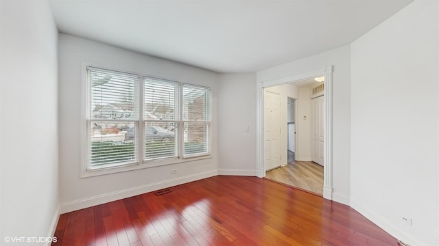 spare room featuring hardwood / wood-style flooring